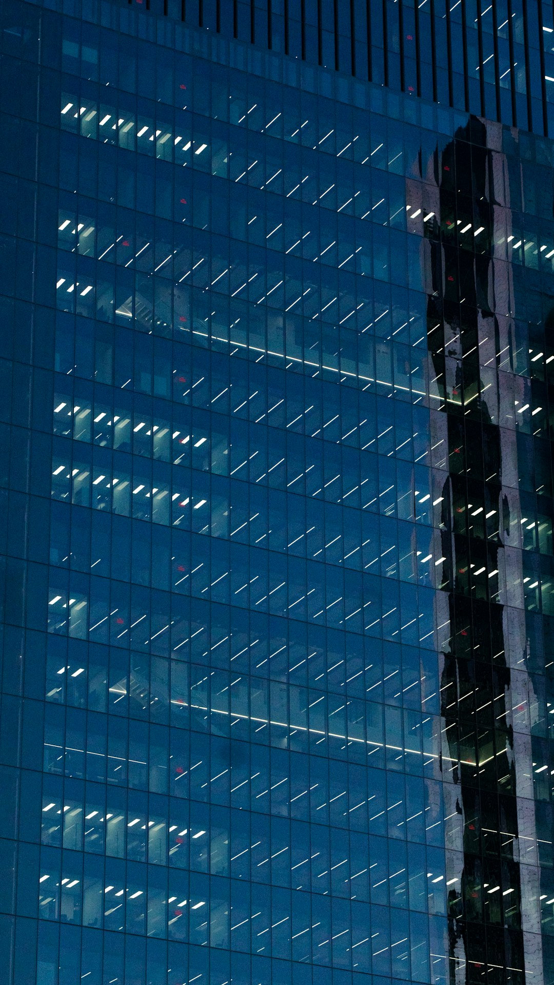 a-very-tall-building-with-a-lot-of-windows-wcakm7khffy